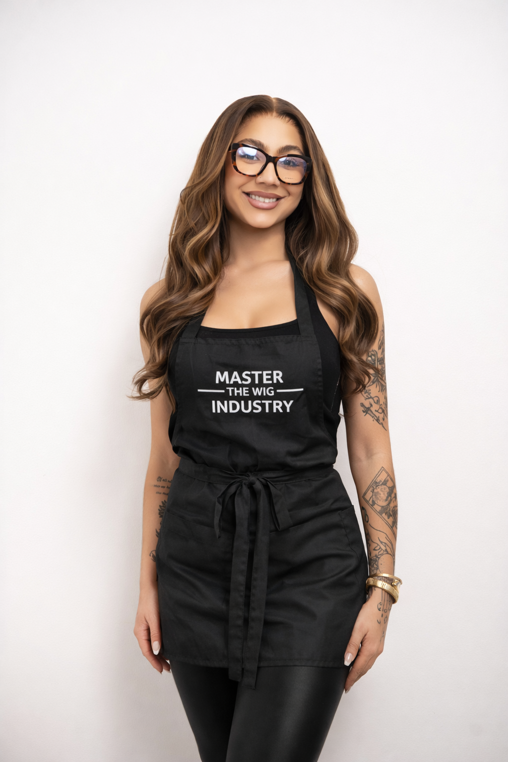 Jada, wig colorist and MIXD founder, in a Master the Wig Industry apron